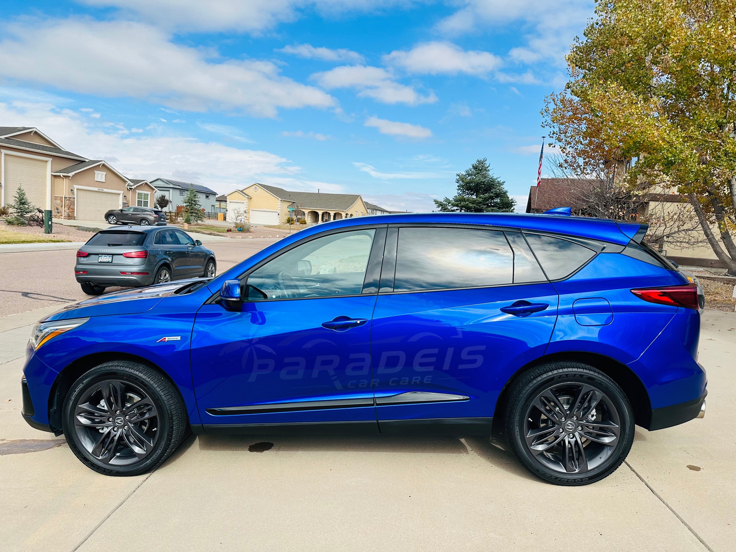 Blue Acura RDX detailed by Paradeis Car Care, driver-side profile