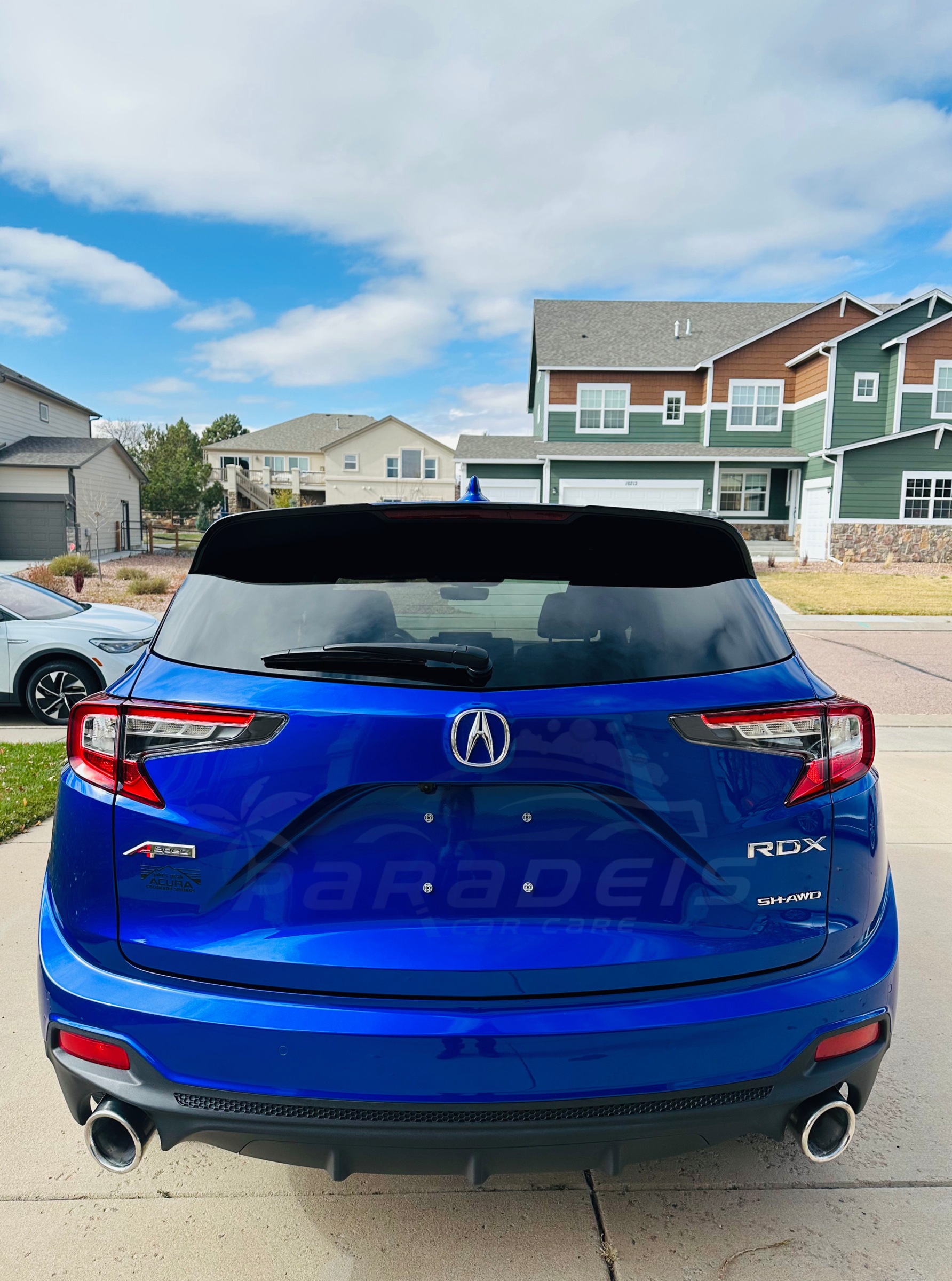 Blue Acura RDX detailed by Paradeis Car Care, rear view