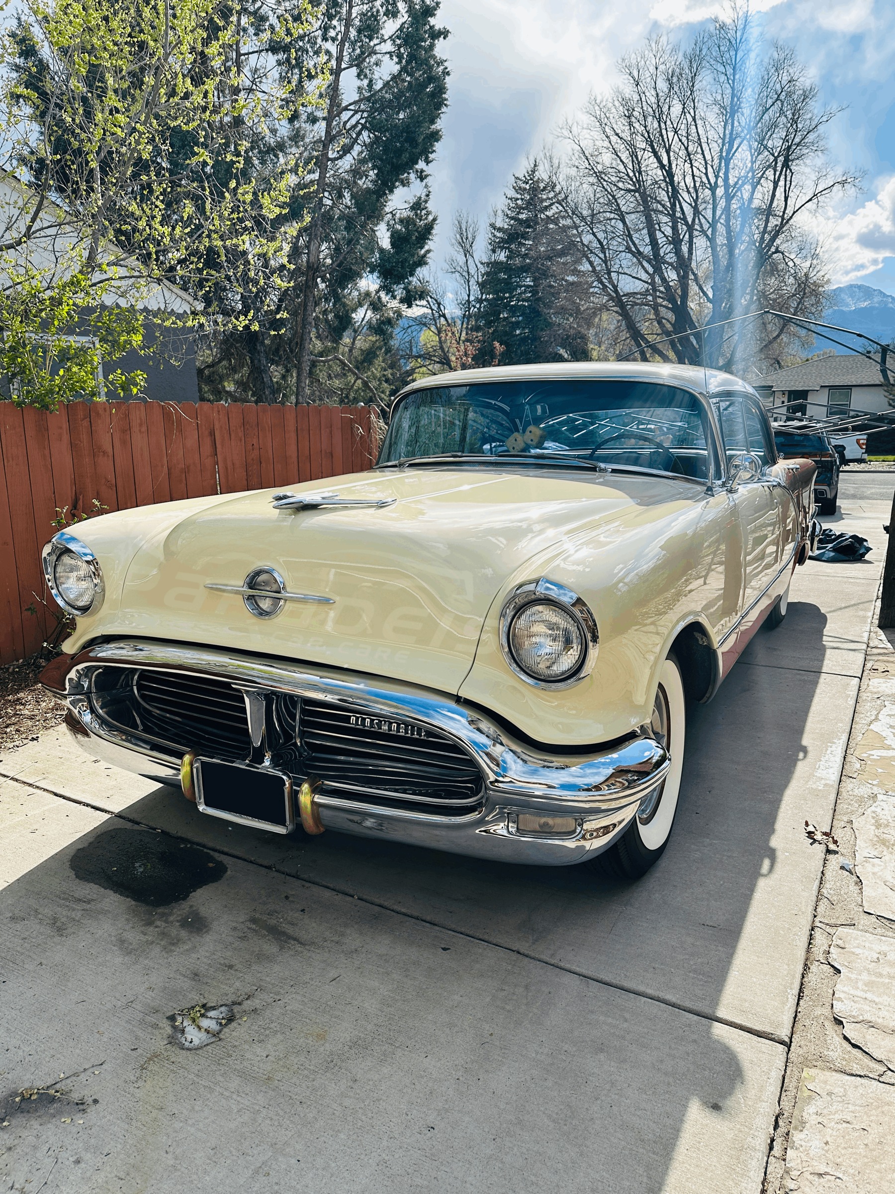 Finished two-tone 1956 Oldsmobile with gleaming chrome, detailed by Paradeis Car Care