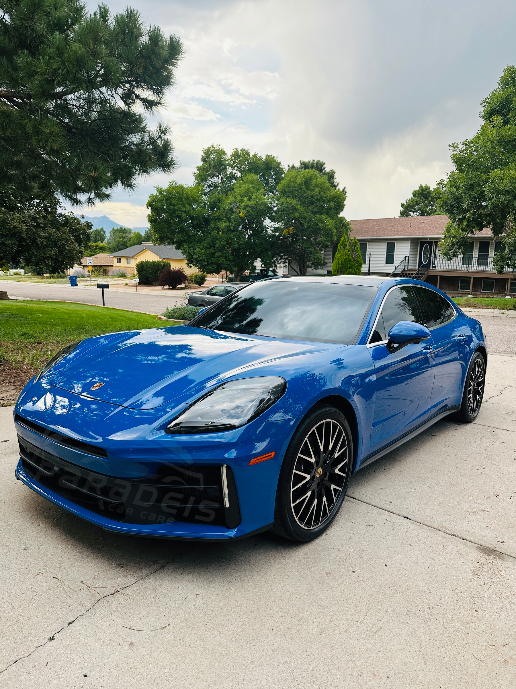 Blue Porsche, front three-quarter view
